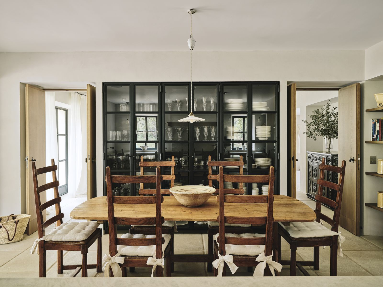 Image may contain Architecture Building Dining Room Dining Table Furniture Indoors Room Table Accessories and Bag