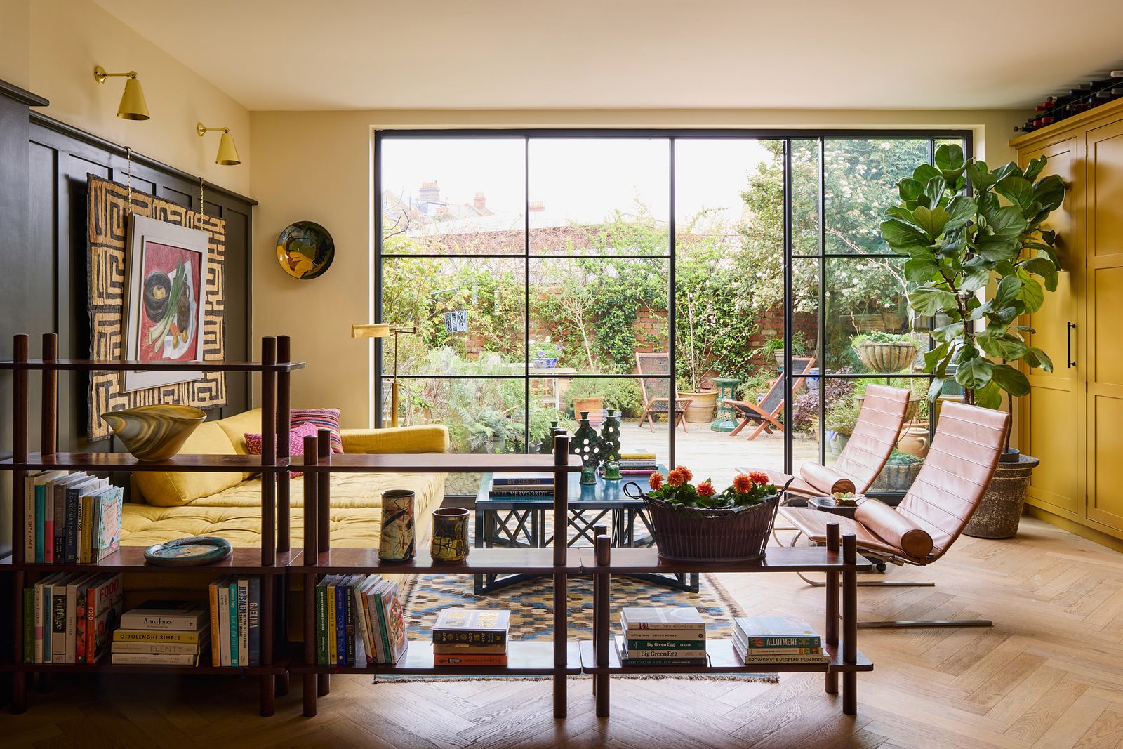 Image may contain Lamp Plant Architecture Building Furniture Indoors Living Room Room Home Decor and Chair