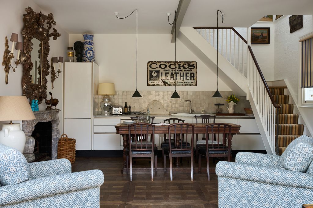 Image may contain Architecture Building Dining Room Dining Table Furniture Indoors Room Table Living Room and Lamp