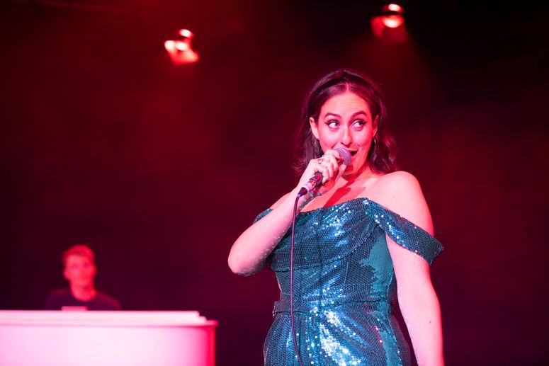 Image may contain: Electrical Device, Microphone, Performer, Person, Solo Performance, Adult, Leisure Activities, and Music