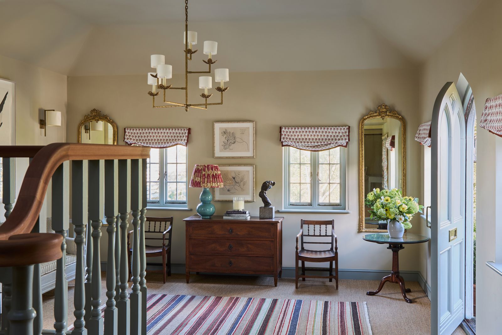 Image may contain Lamp Chair Furniture Home Decor Rug Indoors Art Painting Desk Table Person and Architecture