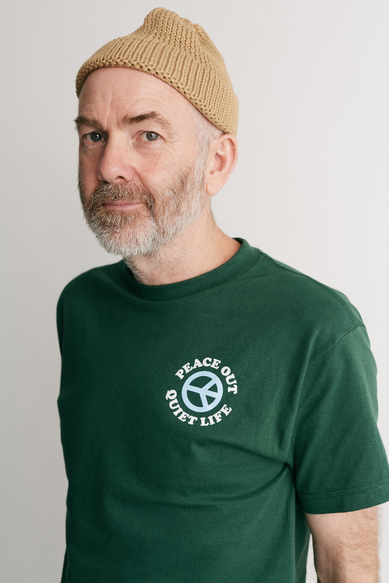 Image may contain Cap Clothing Hat TShirt Adult Person Beanie Head and Face