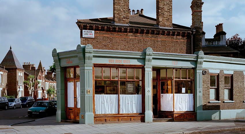 Image may contain Car Transportation Vehicle City Architecture Building Housing Person Hotel Urban and House