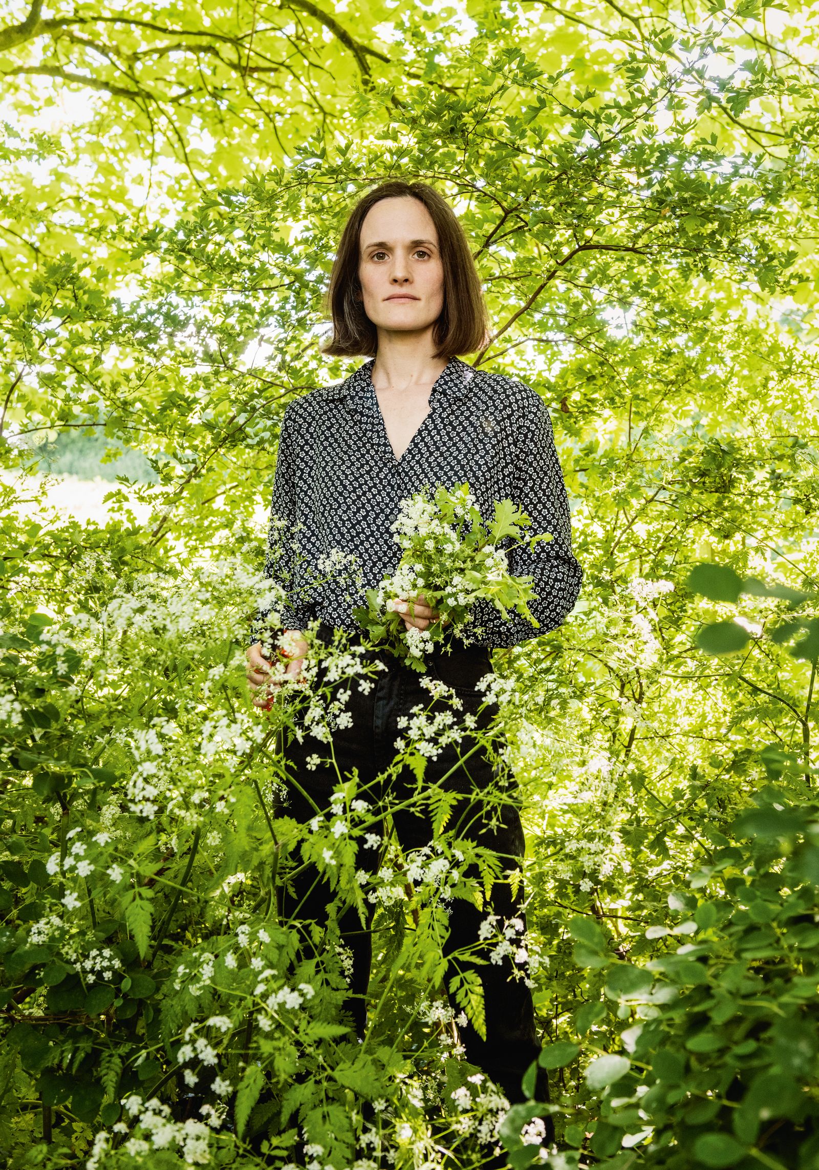 Image may contain Herbal Herbs Plant Vegetation Face Head Person Photography Portrait Adult Blouse and Clothing