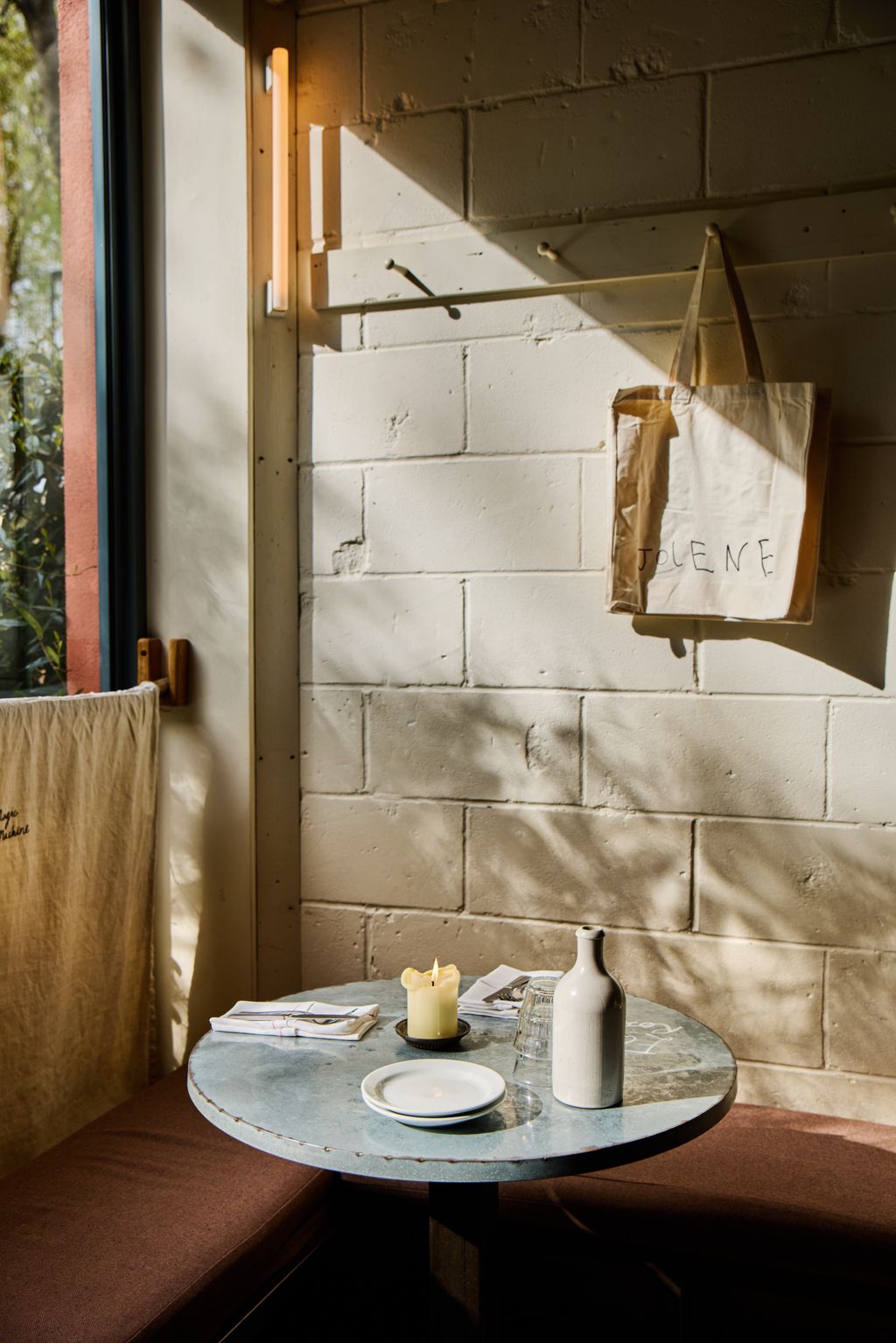 Image may contain Furniture Table Tabletop Dining Table Plywood Wood Accessories Bag Handbag Candle and Plate