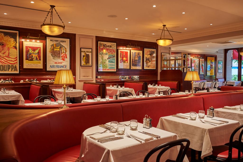 Image may contain Indoors Restaurant Lamp Cup Dining Table Furniture Table Architecture Building and Dining Room