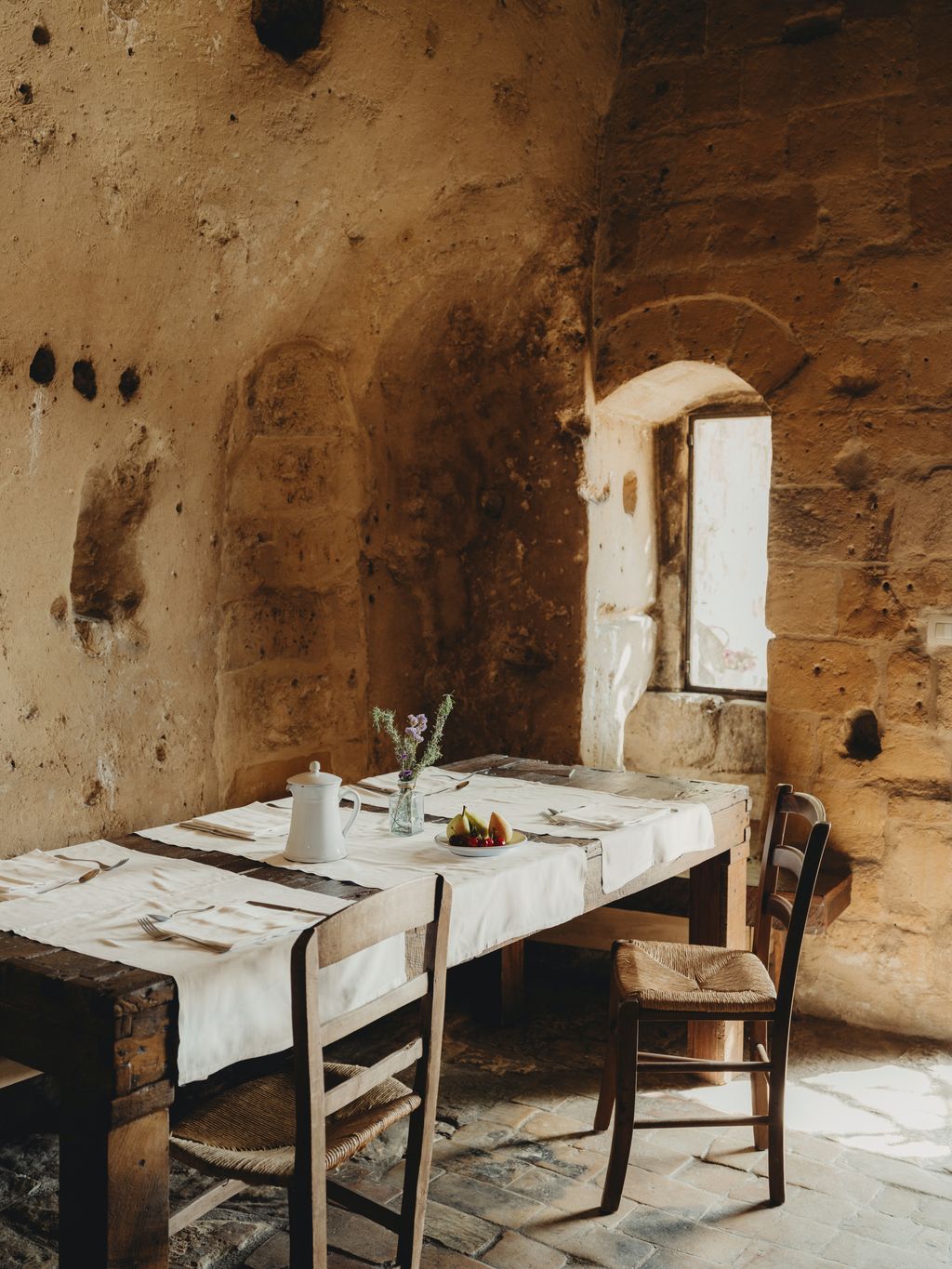 Image may contain Furniture Table Dining Table Chair Plate Tabletop Desk Architecture Building and Dining Room