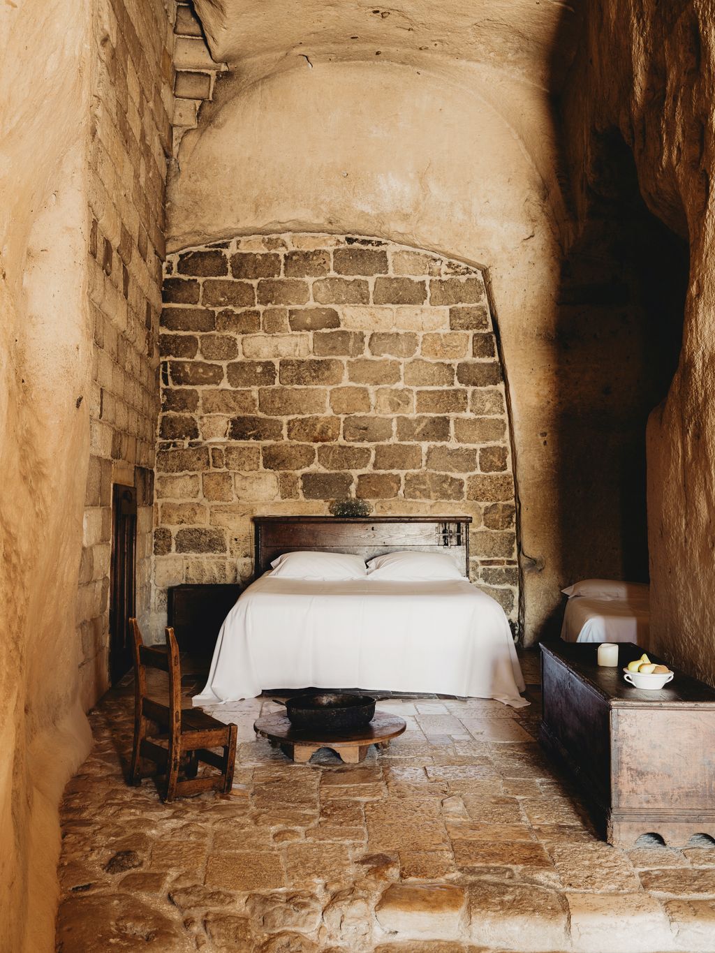 Image may contain Floor Path Walkway Bed Furniture Chair Flagstone Flooring Road Indoors and Fireplace