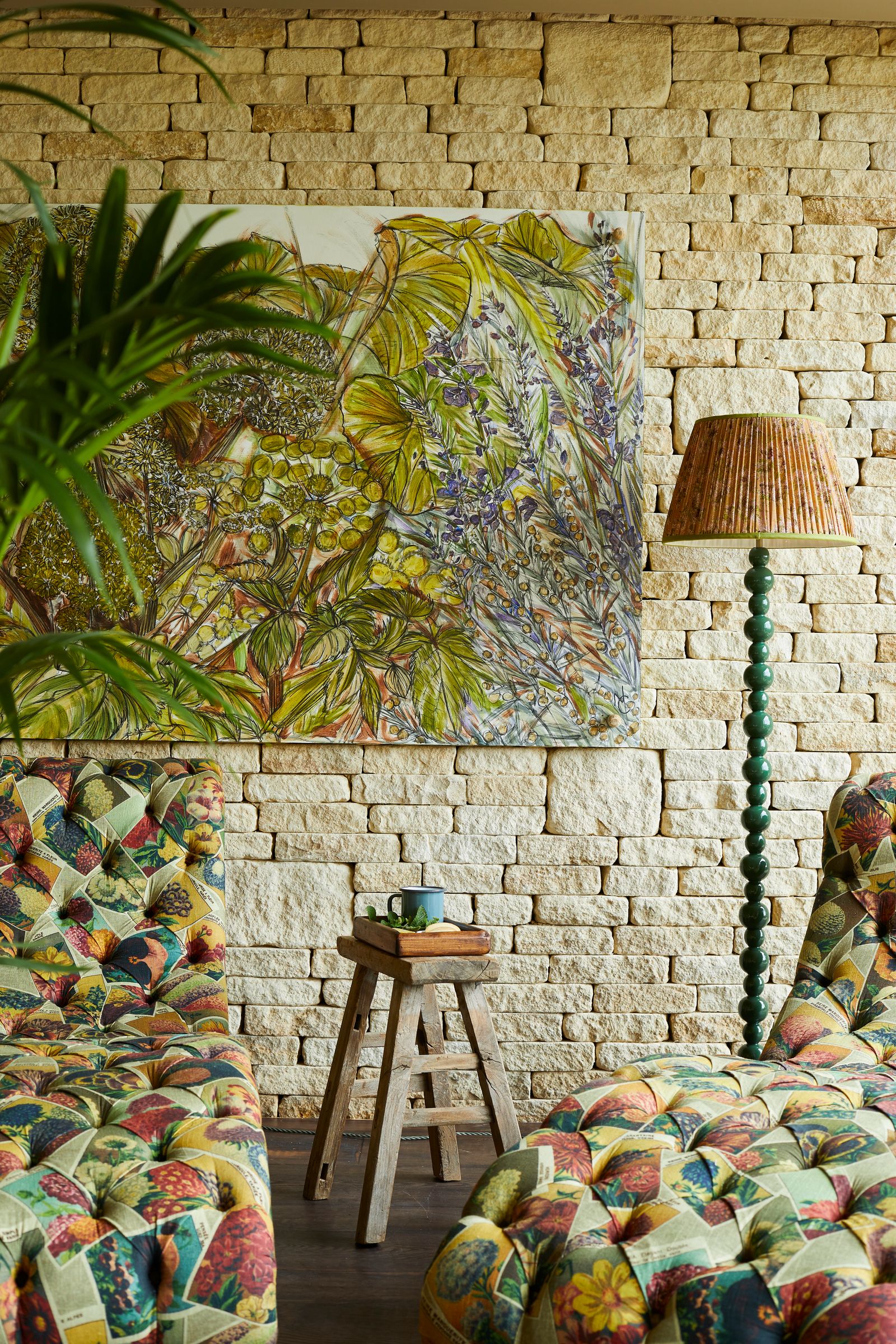 Image may contain Lamp Indoors Interior Design Architecture Building Furniture Living Room Room Cup and Couch