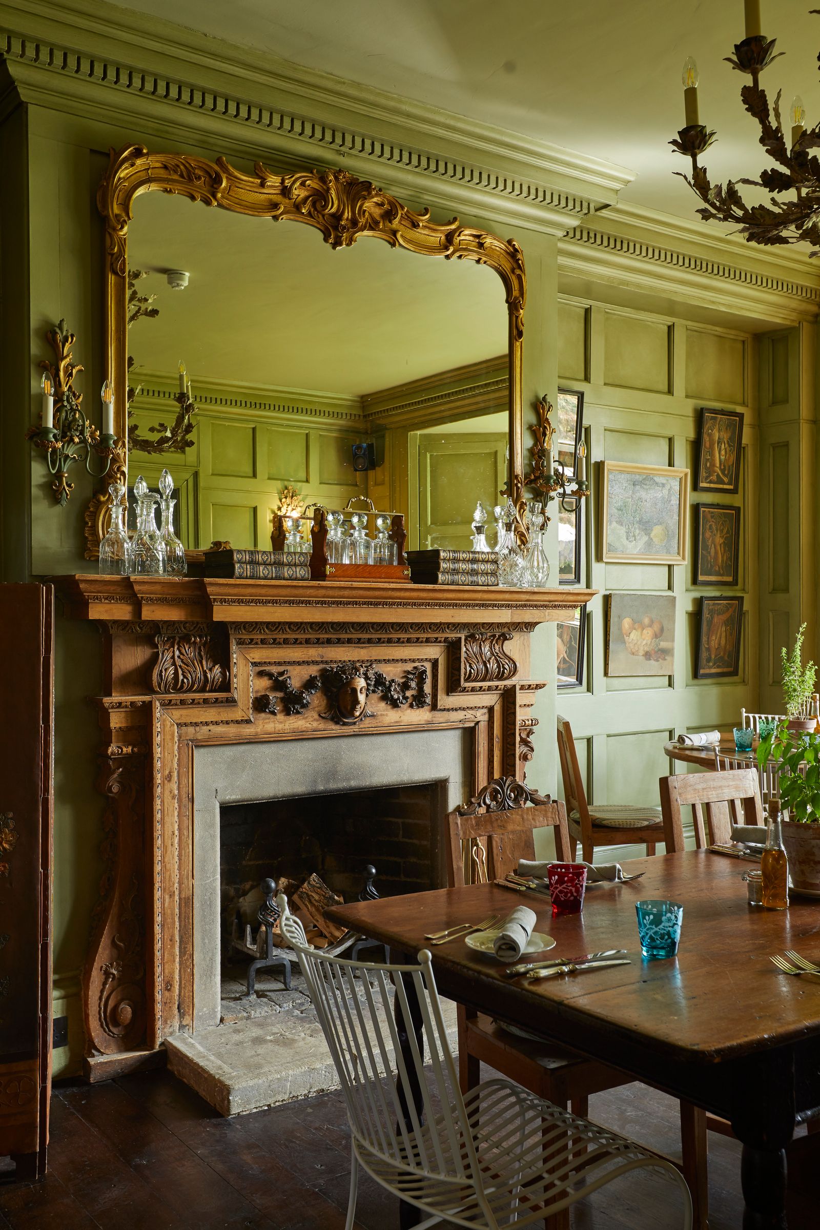 Image may contain Architecture Building Dining Room Dining Table Furniture Indoors Room Table Fireplace and Cup