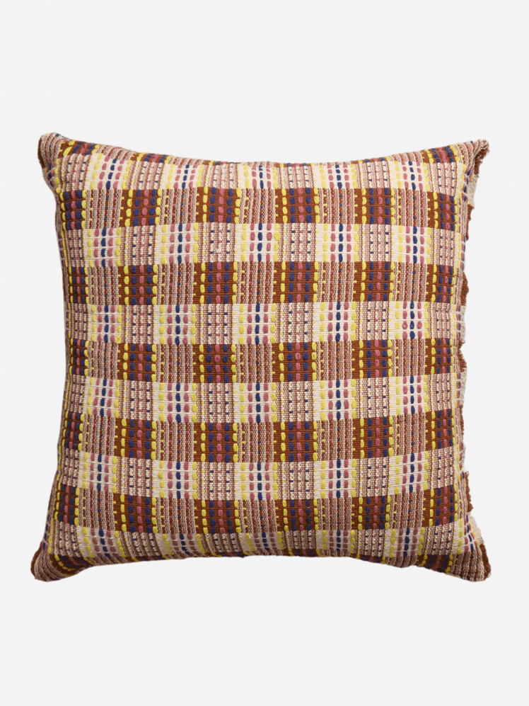 Image may contain: Cushion, Home Decor, Pillow, Clothing, and Skirt