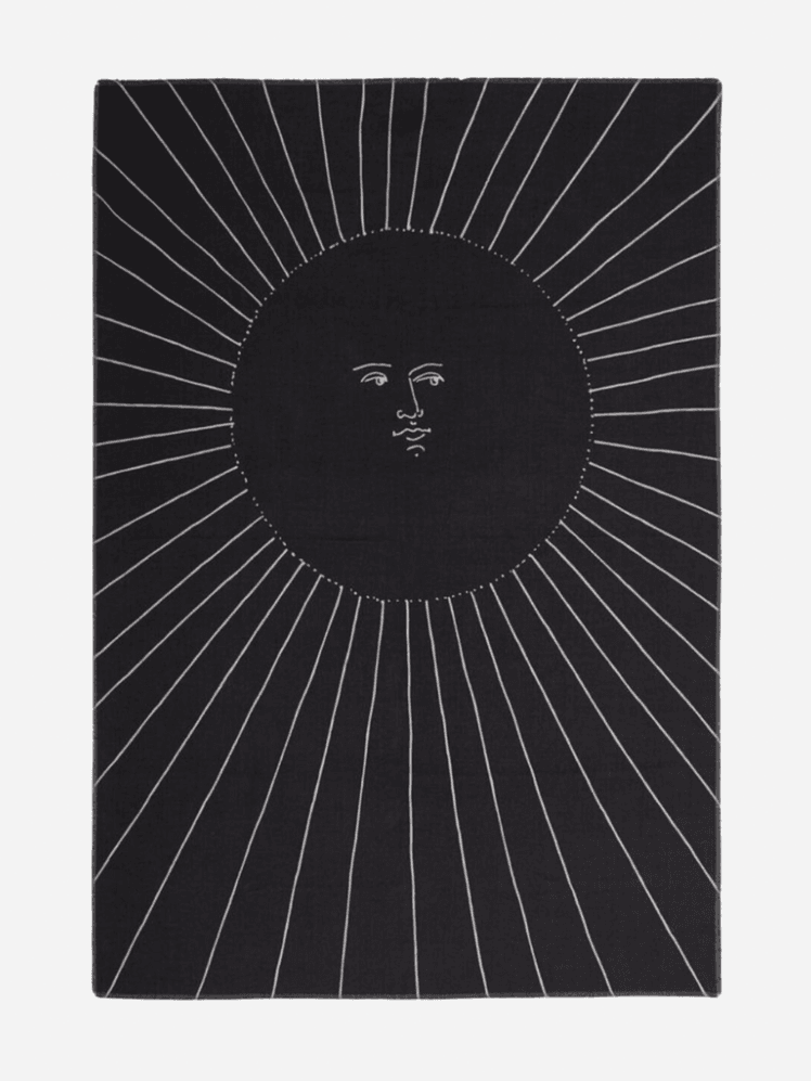 Image may contain: Home Decor, Rug, and Person