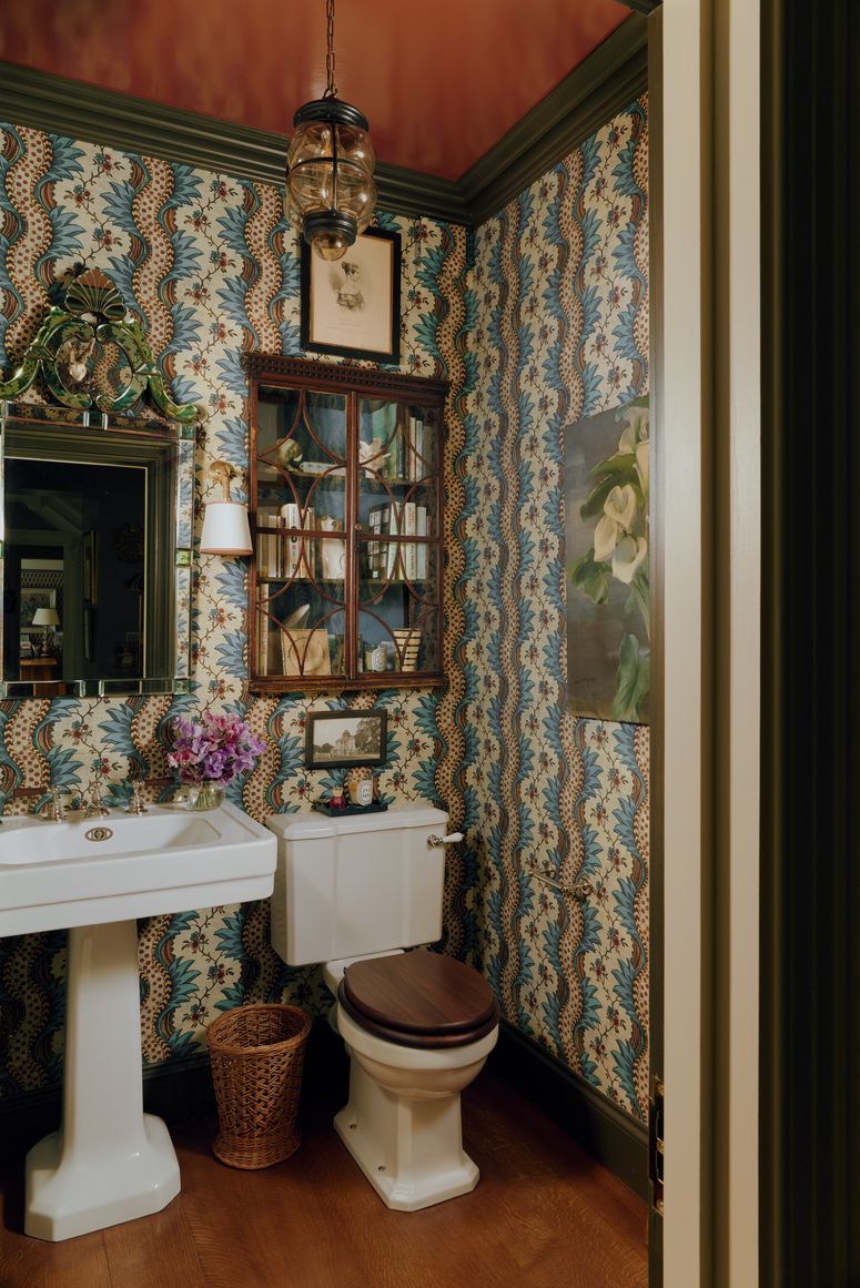 Image may contain: Indoors, Interior Design, Lamp, Corner, Sink, Art, Painting, Bathroom, Room, Toilet, and Cup