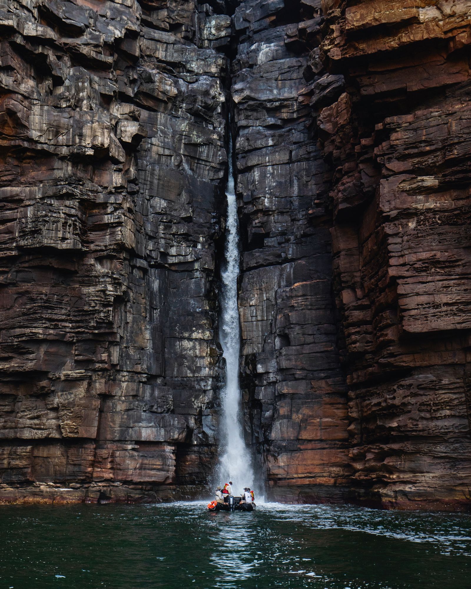 Image may contain Rock Cliff Nature Outdoors Boat Canoe Canoeing Leisure Activities Person Rowboat and Sport