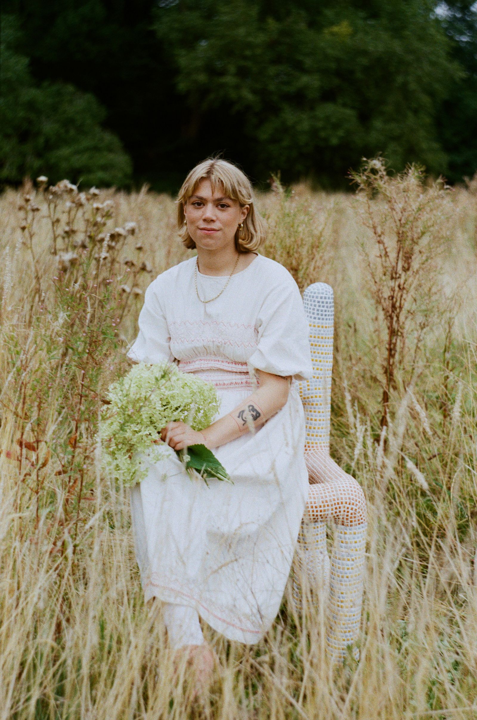 Image may contain Face Head Person Photography Portrait Grass Plant Herbal Herbs Flower and Flower Arrangement