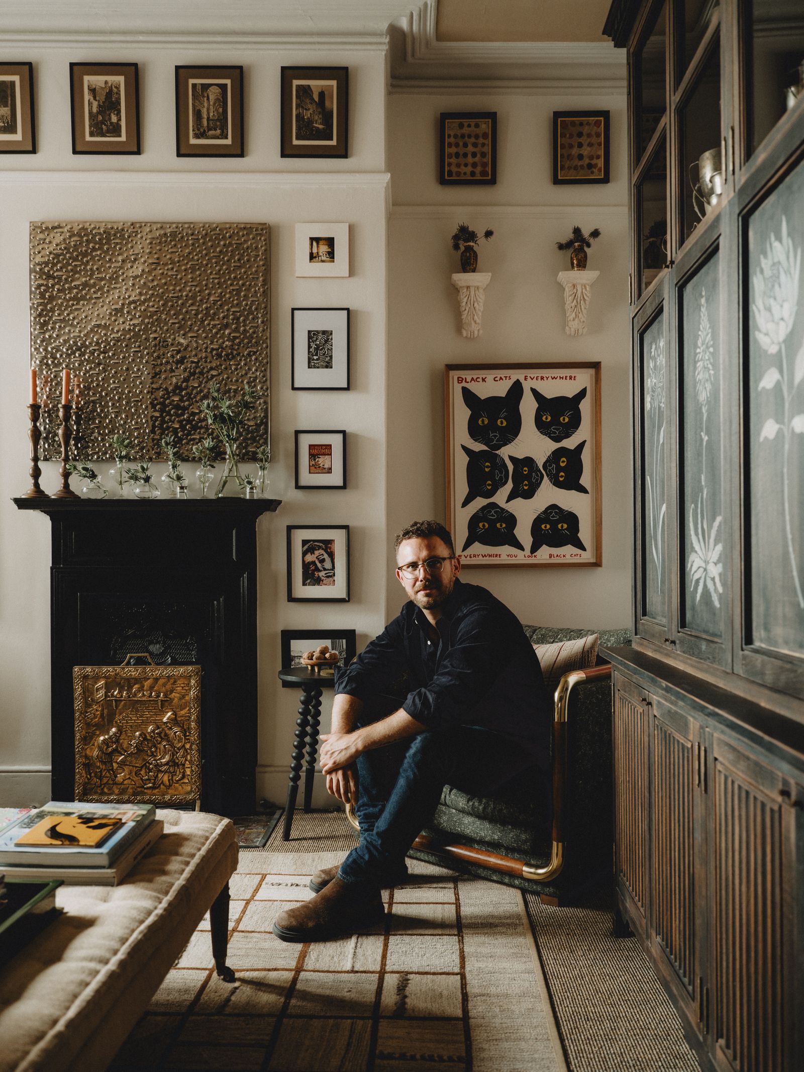 Image may contain Person Sitting Adult Clothing Footwear Shoe Art Painting Accessories Glasses and Chair