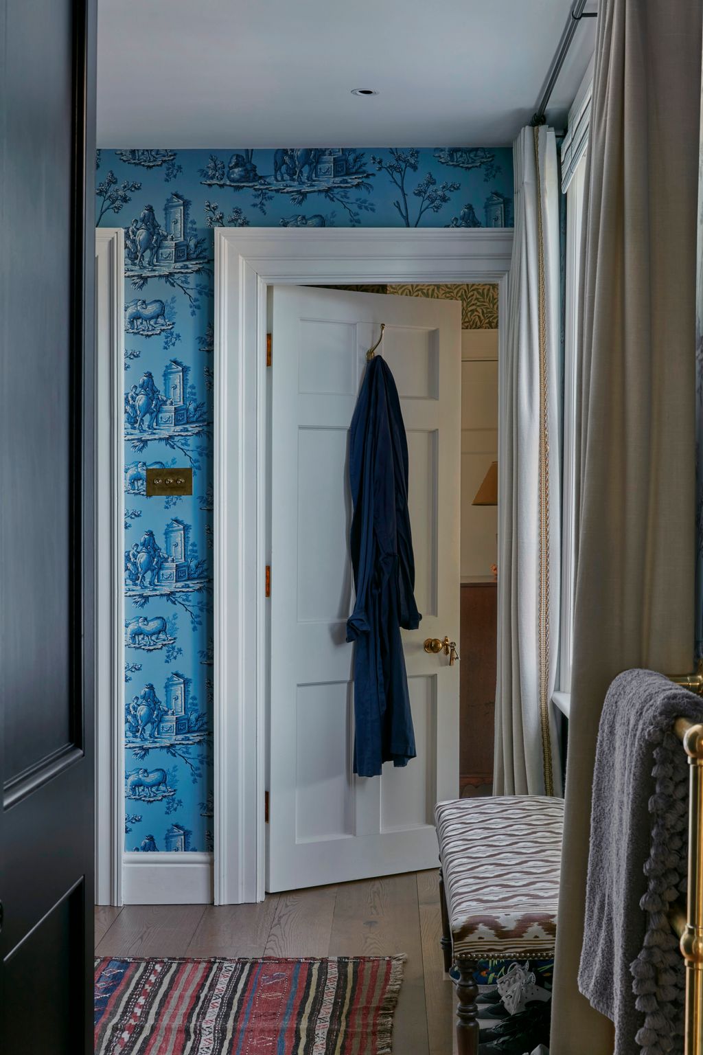 Image may contain Indoors Interior Design Home Decor Rug Floor Bed and Furniture