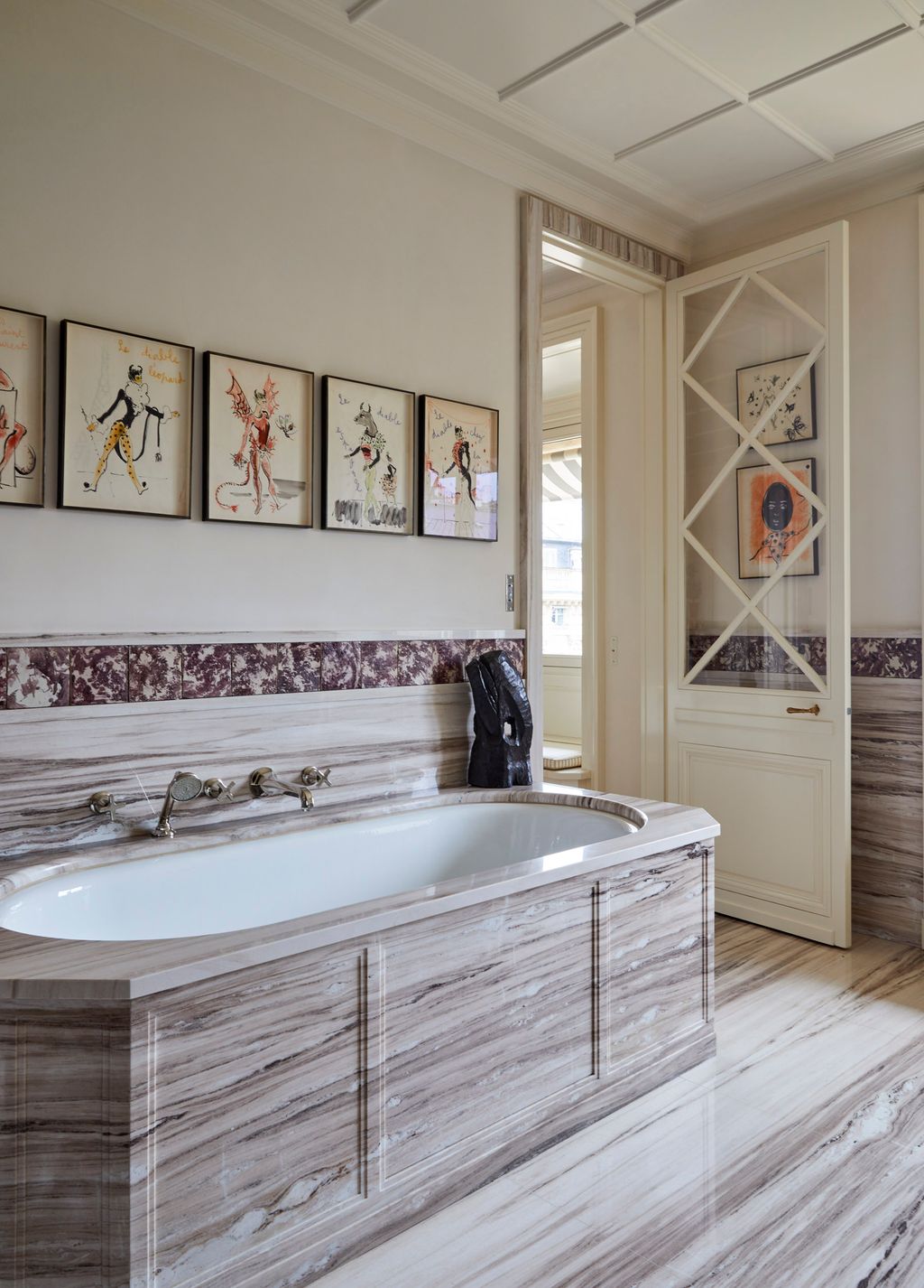 Image may contain Indoors Interior Design Bathing Bathtub Person Tub Art Painting Accessories Bag and Handbag