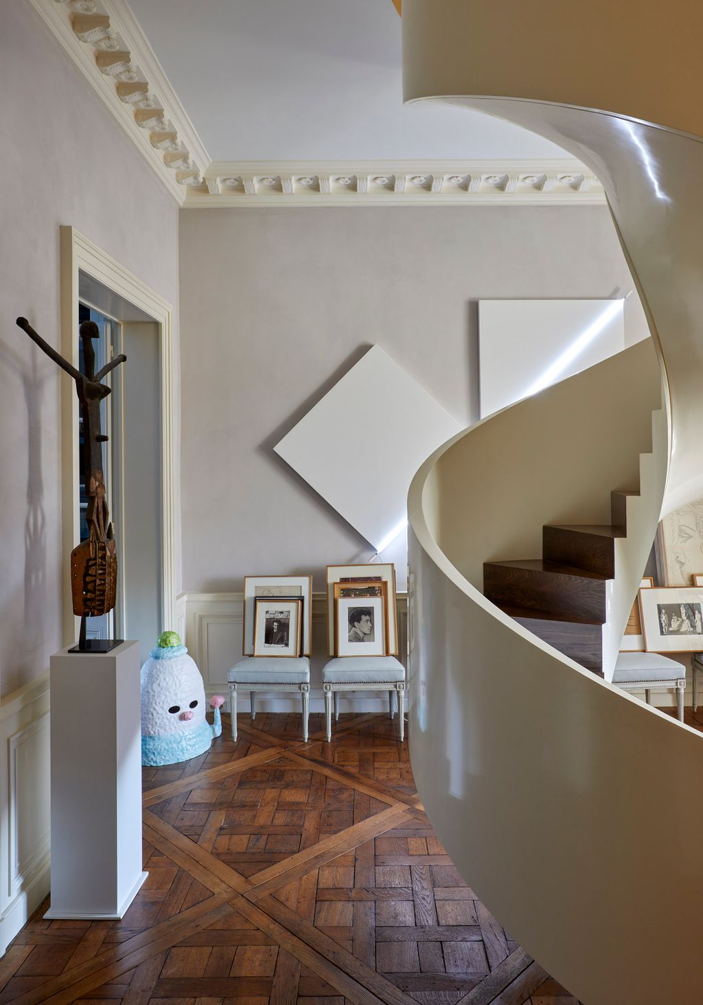 Image may contain Indoors Architecture Building Foyer Floor House Housing Staircase Chair and Furniture