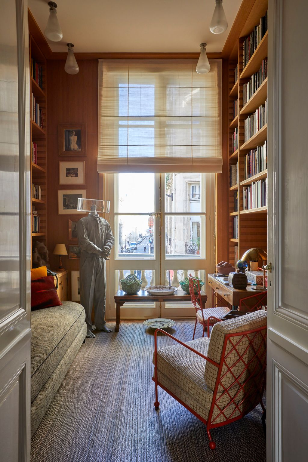 Image may contain Lamp Adult Person Art Painting Home Decor Furniture Indoors Interior Design Chair and Clothing