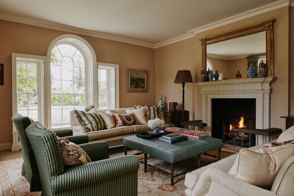 Image may contain Lamp Home Decor Furniture Couch Book Publication Art Painting Architecture Building and Indoors