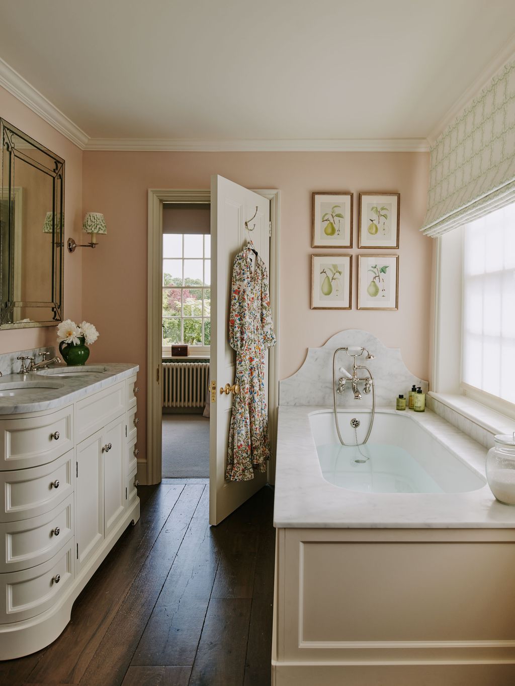 Image may contain Corner Indoors Interior Design Lamp Bathing Bathtub Person Tub Sink Sink Faucet and Art