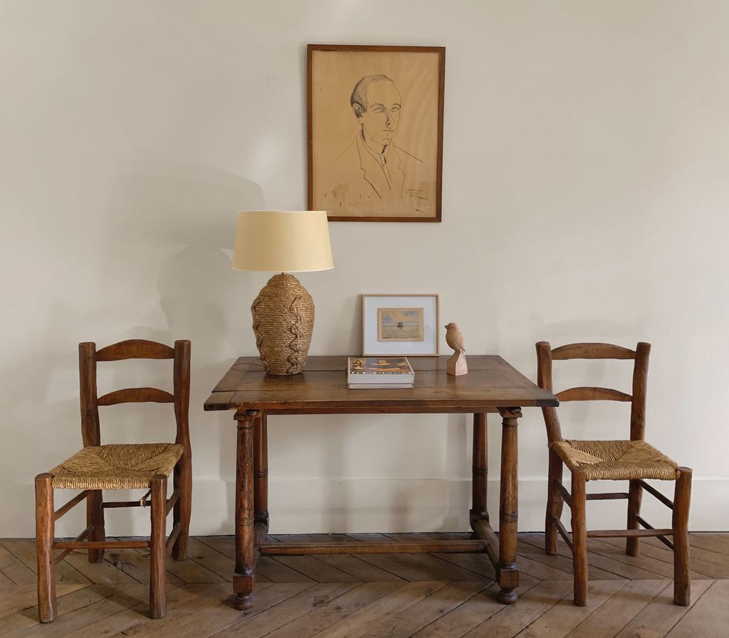 Image may contain Furniture Table Lamp Dining Table Desk Chair Wood Tabletop Art Painting and Indoors