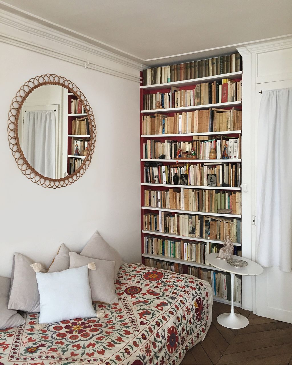 Image may contain Furniture Bookcase Bed Desk Table and Person