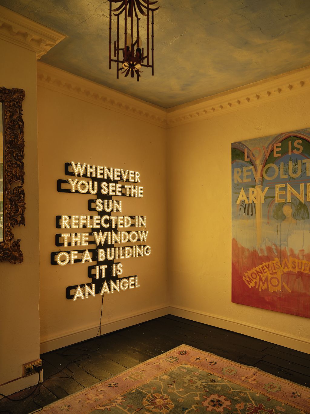 Image may contain Chandelier Lamp Home Decor Rug Art Painting Indoors Interior Design Floor and Flooring