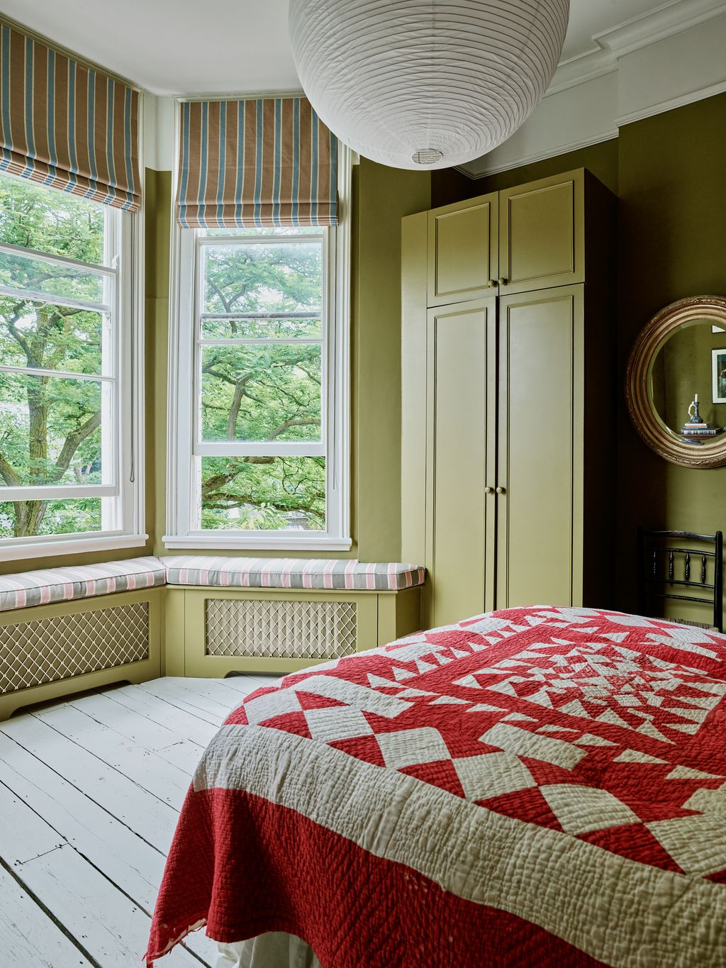 Image may contain Indoors Interior Design Bed Furniture Window Chair Lamp Art Painting Home Decor and Bench