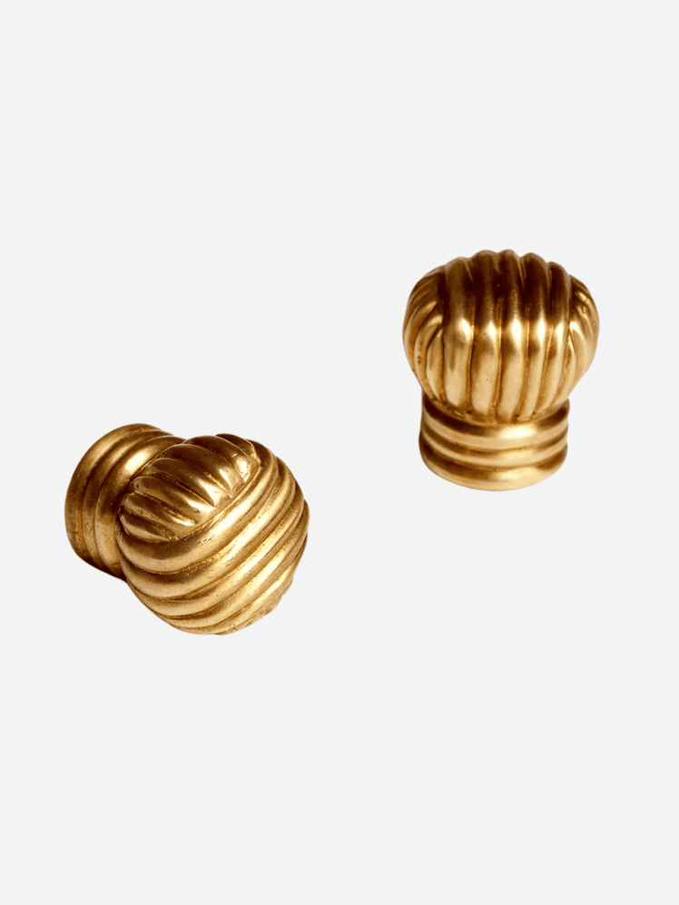 Image may contain: Bronze, Gold, Treasure, and Smoke Pipe