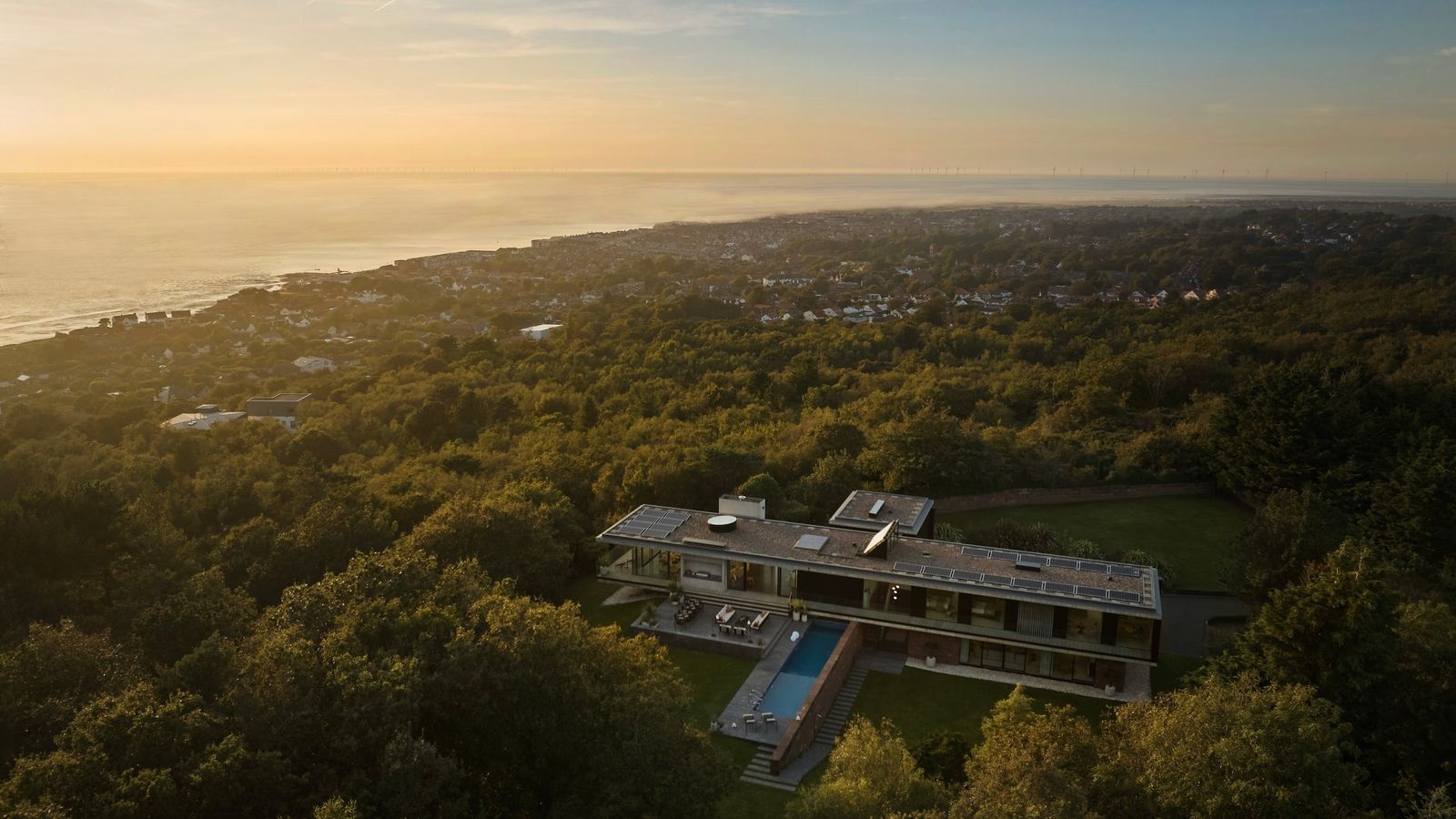 Image may contain Outdoors Plant Vegetation Land Nature Tree Woodland Architecture Building Sea and Water