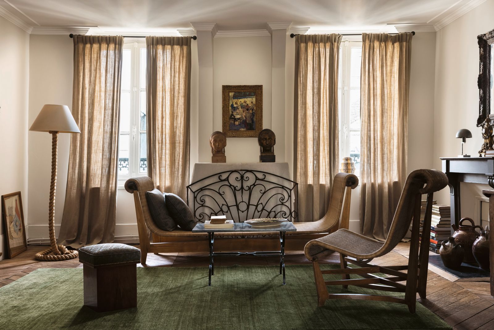 Image may contain Home Decor Lamp Chair Furniture Architecture Building Indoors Living Room Room Rug and Art