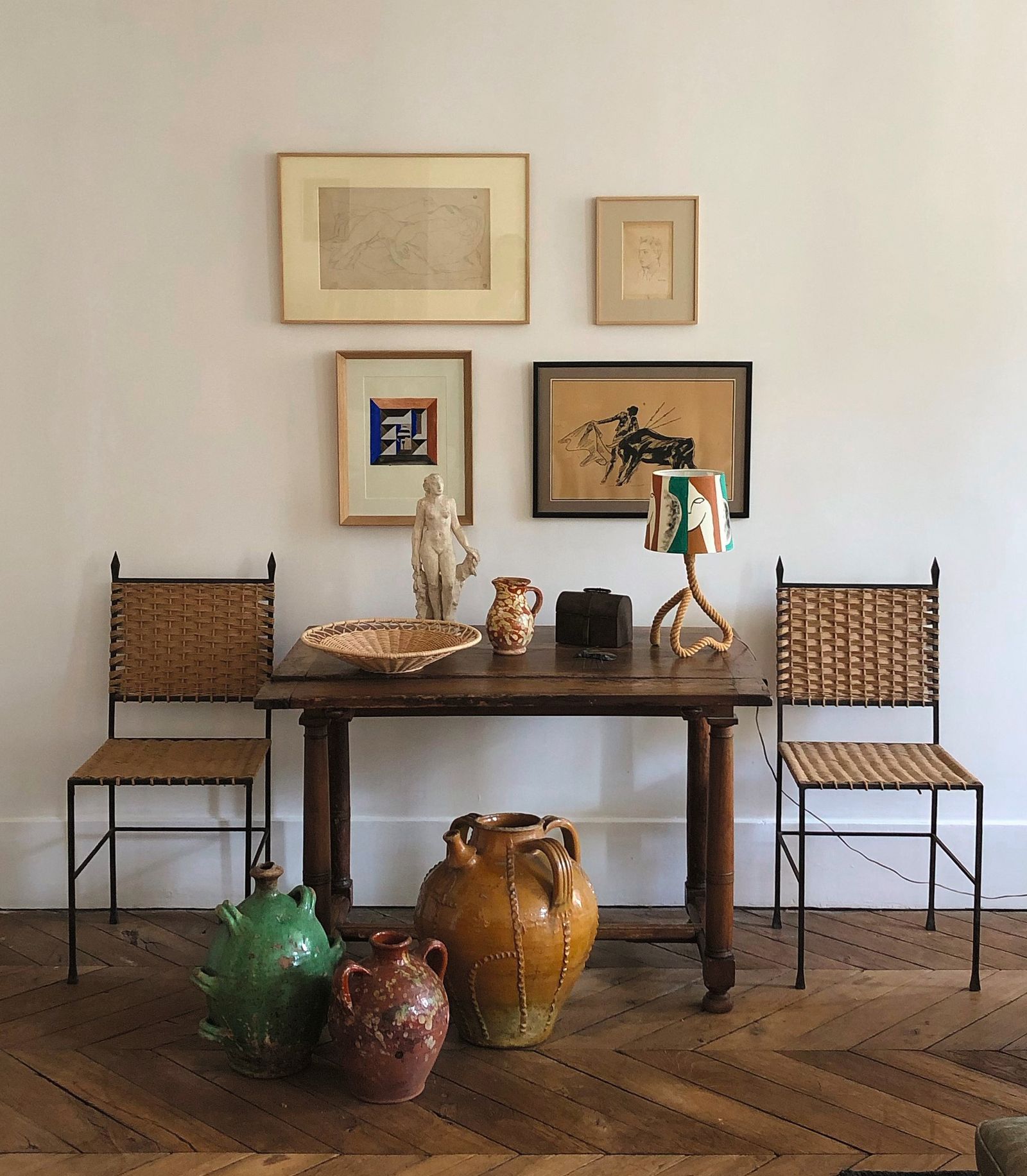 Image may contain Indoors Interior Design Furniture Table Chair Desk Art Painting Hardwood Stained Wood and Wood