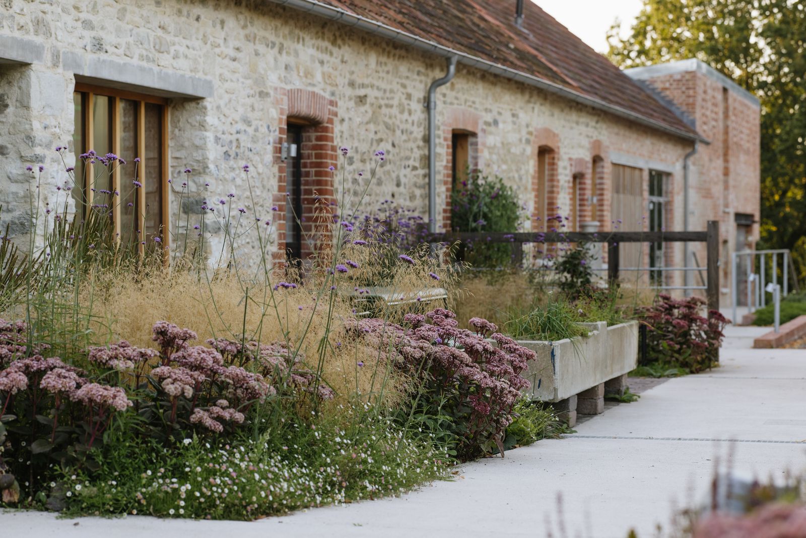 Image may contain City Architecture Building Cottage House Housing Road Street Urban Nature Outdoors and Yard