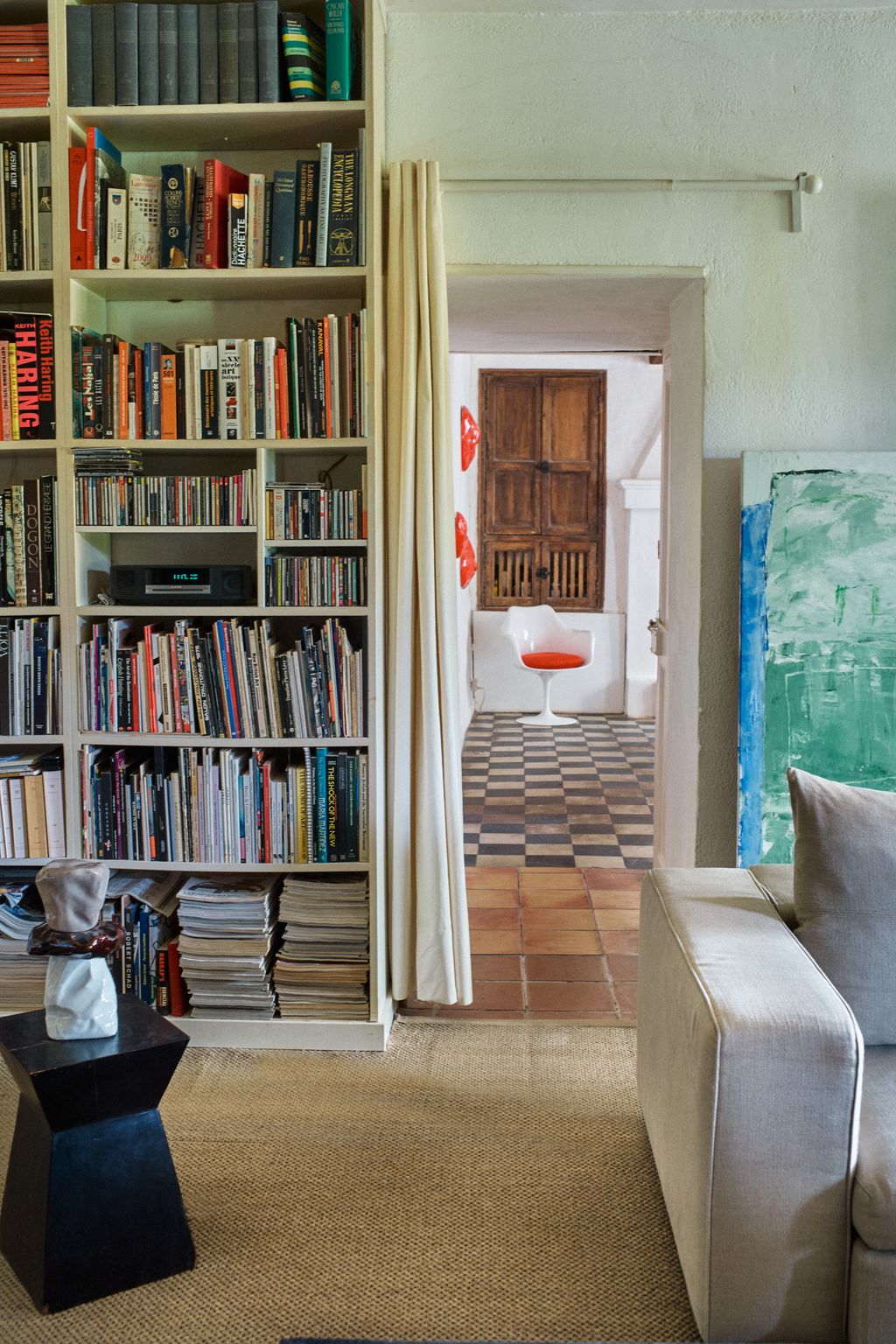 Image may contain Furniture Chair Bookcase Couch and Person