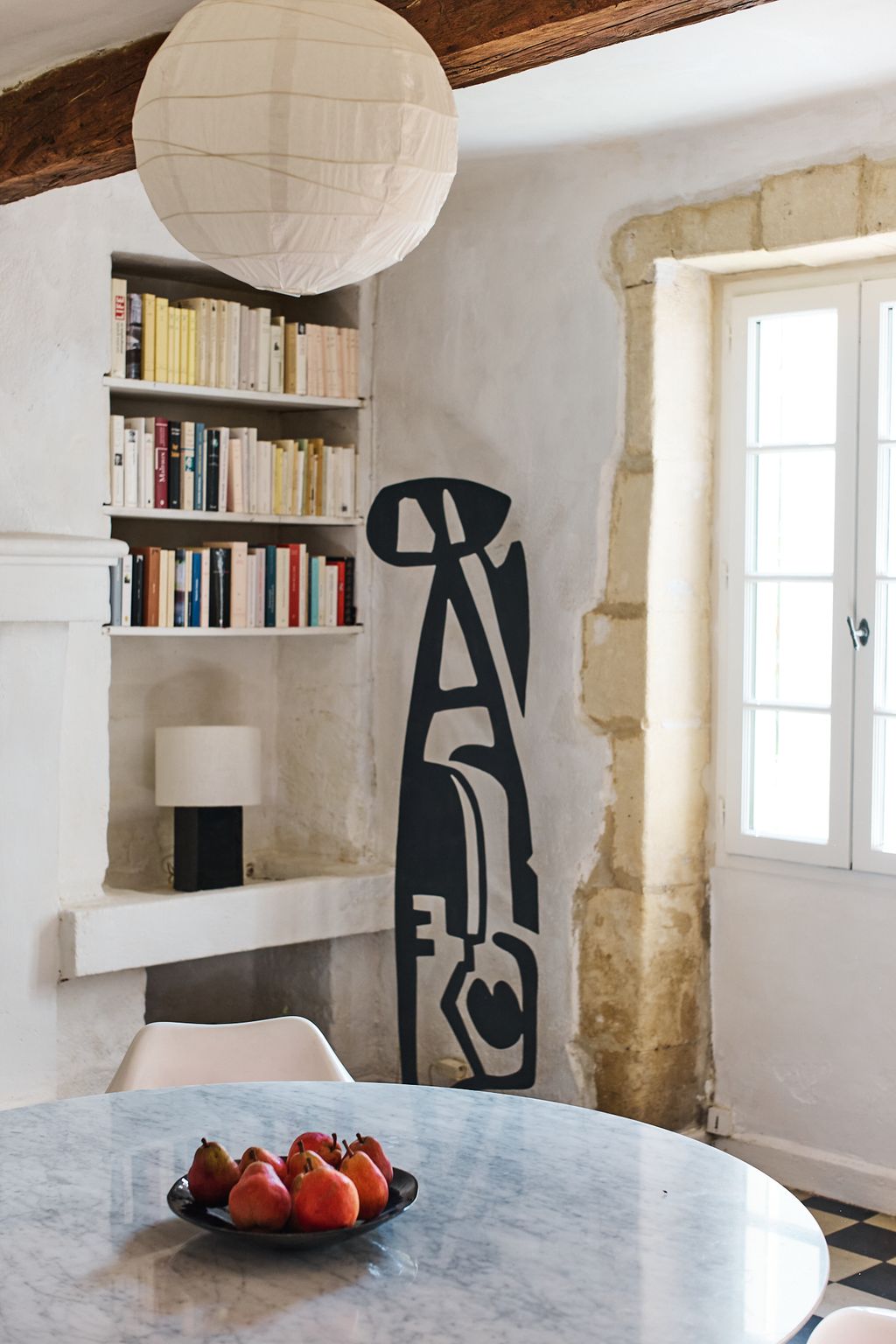 Image may contain Chair Furniture Desk Table Architecture Building Dining Room Dining Table Indoors Room and Plate