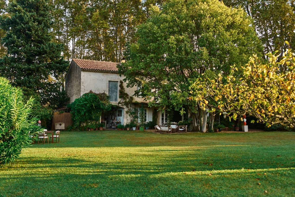 Image may contain Grass Plant Lawn Architecture Building Cottage House Housing Villa Chair Furniture and Nature