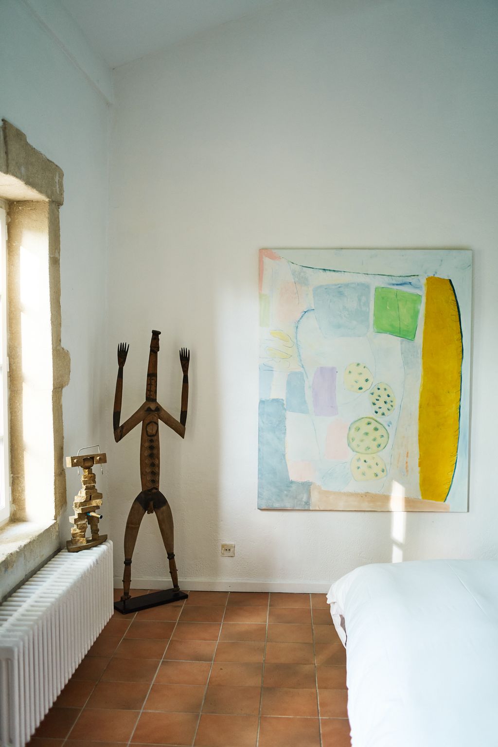 Image may contain Indoors Interior Design Floor Corner Bed Furniture Person Art Painting and Flooring