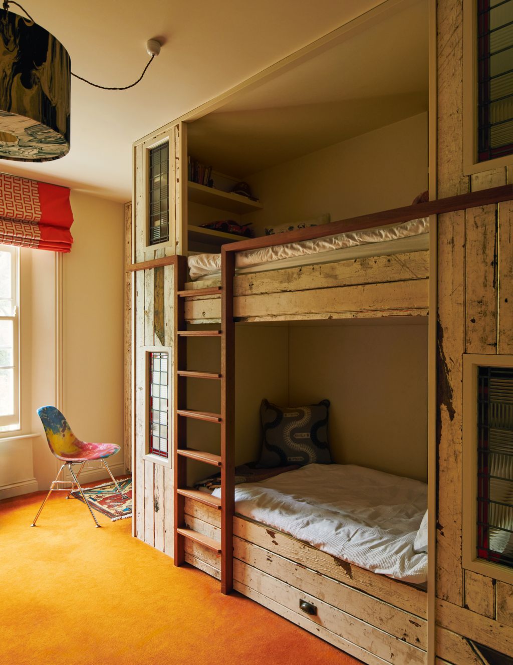 Image may contain Chair Furniture Indoors Interior Design Home Decor Rug Architecture Building Hostel and Housing