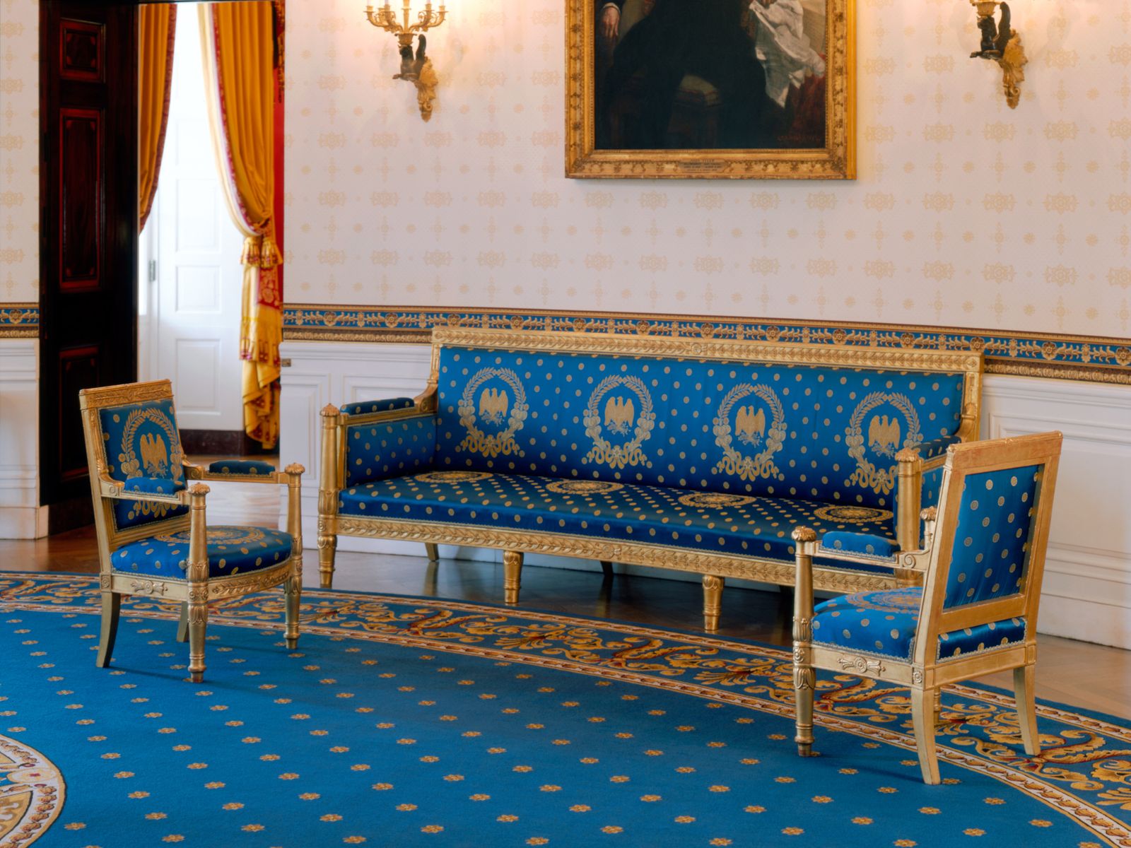 Image may contain Home Decor Indoors Room Waiting Room Reception Reception Room Rug Chair Furniture and Art