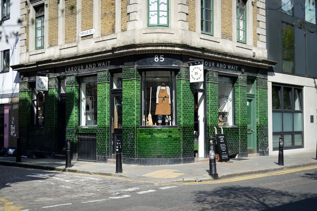 Image may contain City Road Street Urban Neighborhood Person Shop Cafe Indoors Restaurant and Fire Hydrant