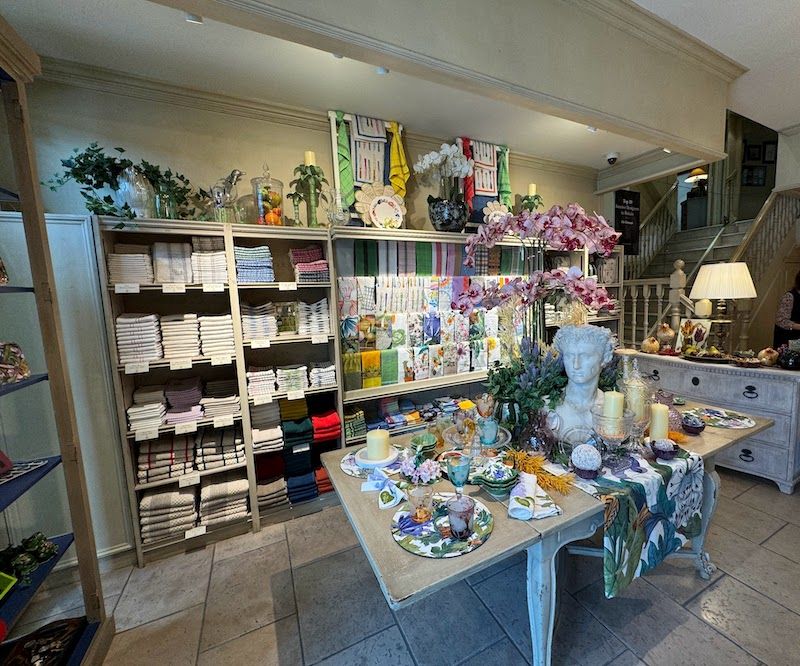 Image may contain Lamp Cup Person Indoors Candle Shop Plate Art and Painting