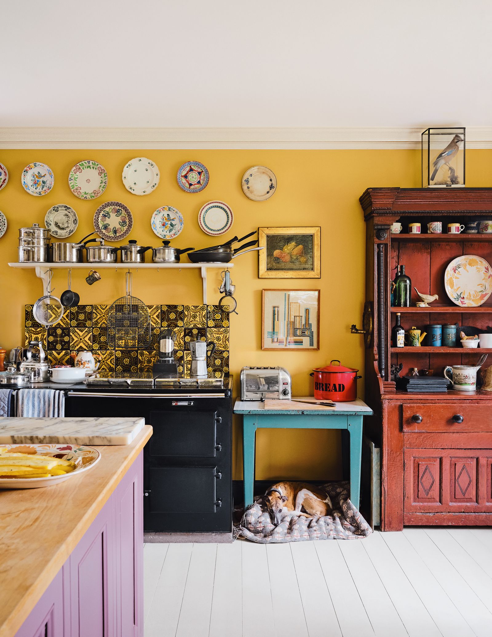 Image may contain Indoors Interior Design Desk Furniture Table Art Painting Kitchen Home Decor Plate and Cup