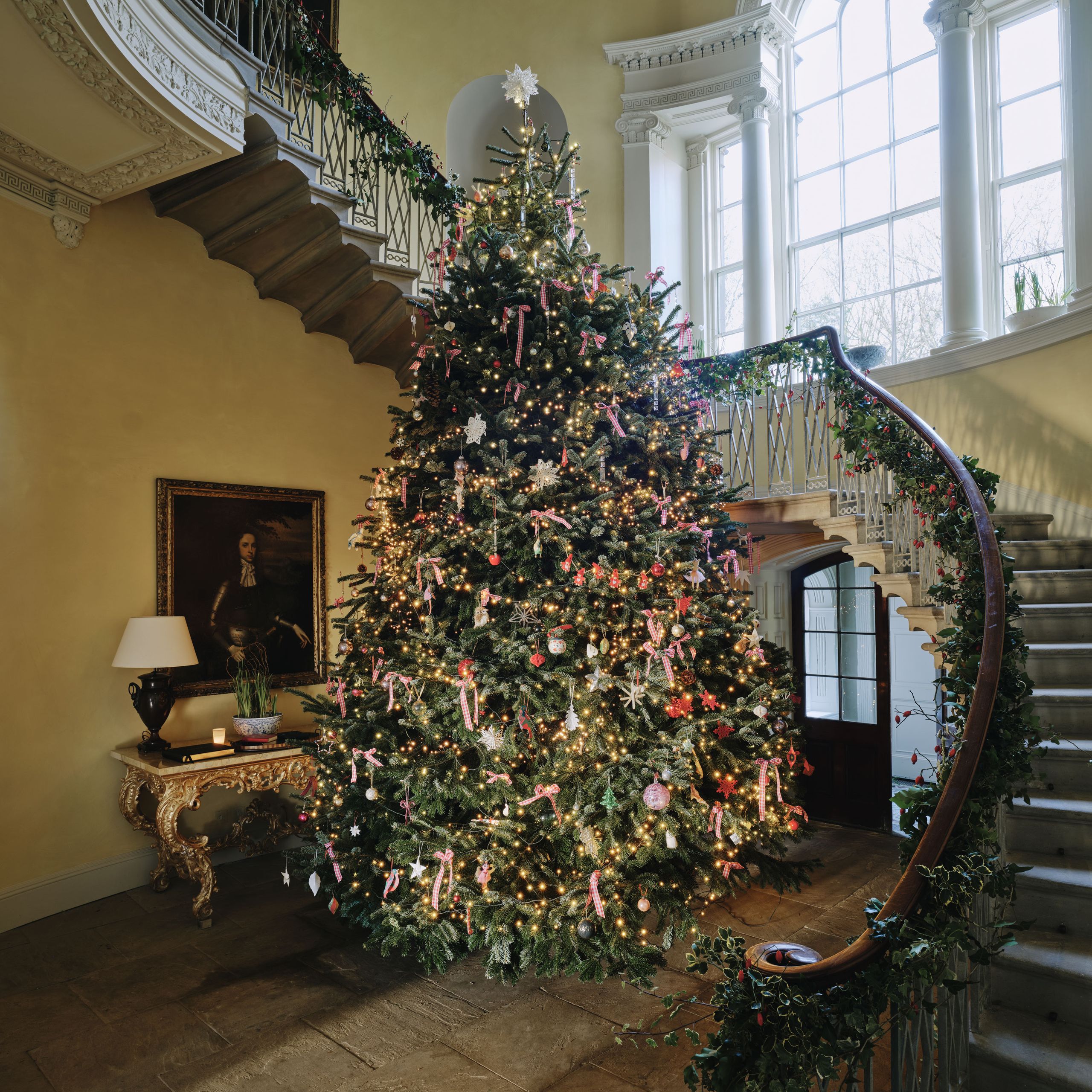 Image may contain Lamp Architecture Building House Housing Staircase Art Painting Desk Furniture Table and Person