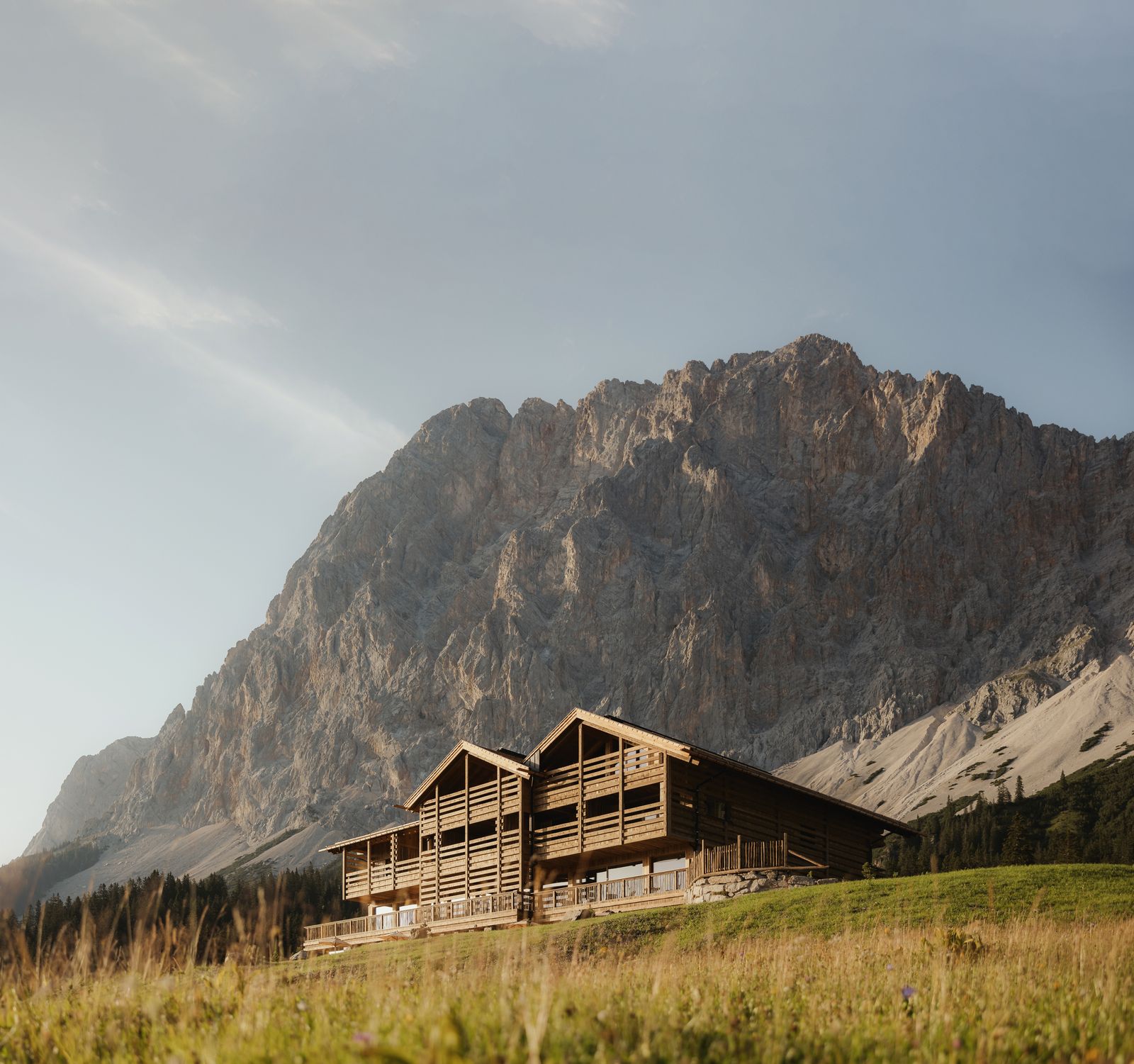 Image may contain Architecture Building Outdoors Shelter Mountain Mountain Range Nature Peak and Housing