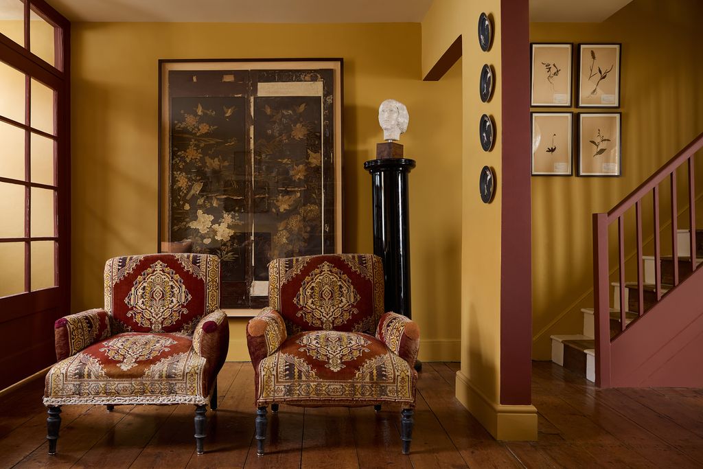 Image may contain Architecture Building Furniture Indoors Living Room Room Chair Interior Design Home Decor and Art