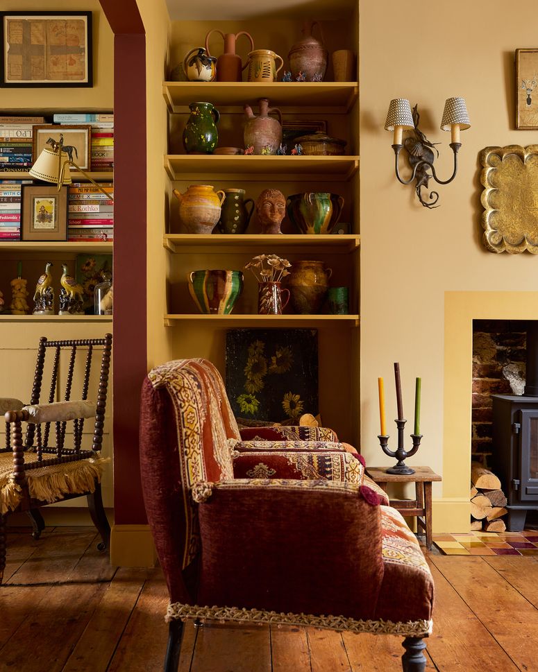 Image may contain: Furniture, Lamp, Chair, Art, Painting, Desk, Table, Indoors, Interior Design, Shelf, and Architecture