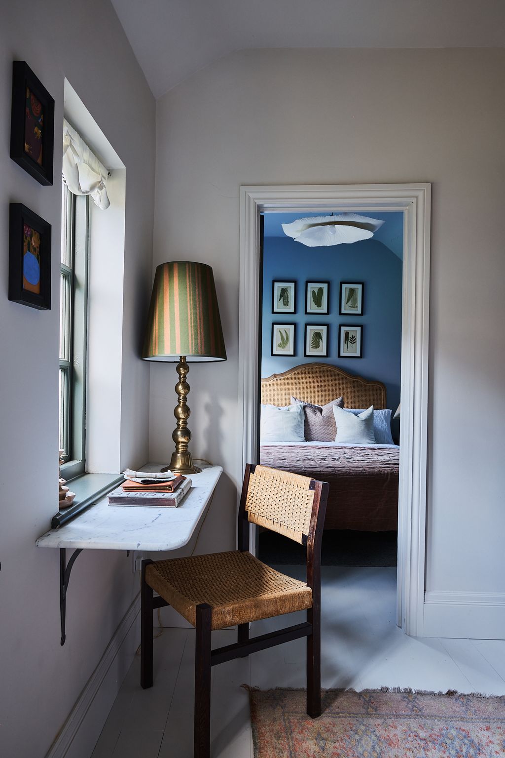 Image may contain Corner Lamp Chair Furniture Bed Home Decor Rug Art Painting Book Publication Table and Indoors