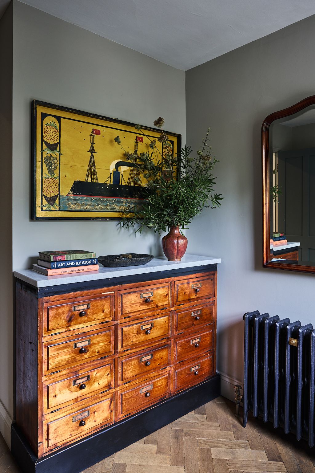 Image may contain Indoors Interior Design Furniture Hardwood Wood Art Painting Book Publication and Stained Wood